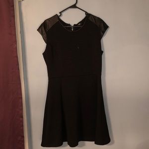 Black dress with leather at the top of the arms